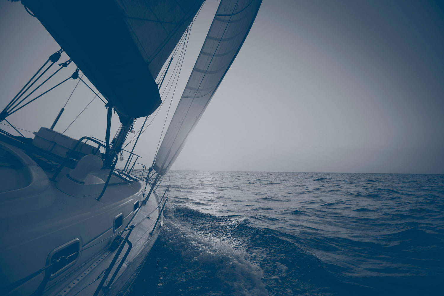 Wealth management firm guiding financial stability like a sailboat on a serene ocean with blue overlay
